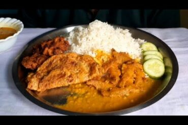 Healthy meals - eating small fish curry, egg omelet with rice