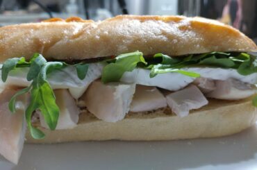Simple lunch: roast chicken, brie, arugula and fig butter sandwich