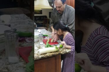 Romi Making Salad With Dad