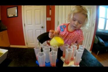 Abi is making homemade healthy snack, fresh fruit ice pops , which she shares with Oli. kids video