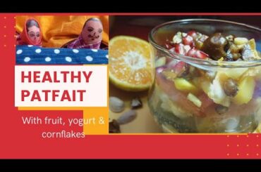 Parfait with cornflakes, fruits and yogurt. A Healthy breakfast recipe. Funny characters.