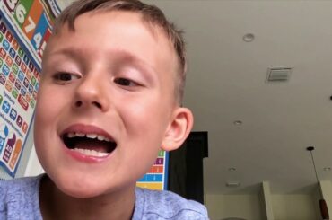 7 year old reading Dr. Seuss while eating healthy salad.)