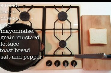 sandwich with bacon, lettuce, cheese and egg. Quick breakfast.