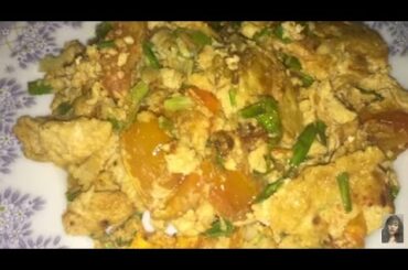 Healthy food, Fried tomatoes with eggs, Cambodian girl cooking at home
