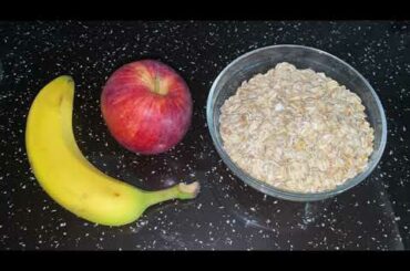 Healthy food with oatmeal, banana, apple and honey  Delicious and healthy breakfast