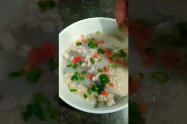 healthy dinner rolled oats with fish and sprinkles spring onions and cupsicum