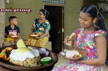 nasi goreng .A very easy homemade nasi goreng is a delicious lunch.  ..village kitchen recipe