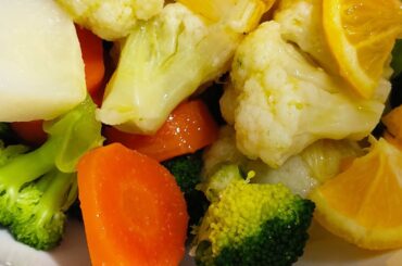 Healthy salad with boiled vegetables, broccoli, cauliflower and carrots