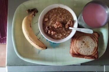 Healthy breakfast recipes, gud daliya with walnuts, cheese sandwich, banana, cold rooh afza milk.