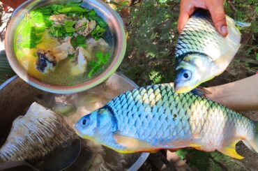 Country women cooking a big fish , making healthy meals for dinner - Country style cooking