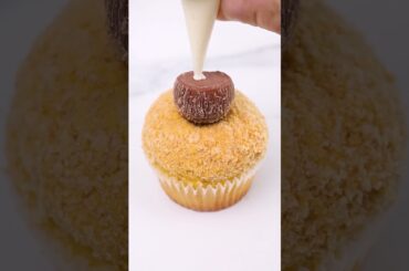 The perfect beach day includes a coconut drink and a cupcake!