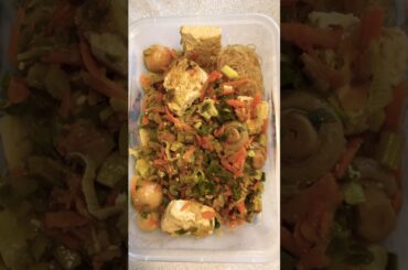 Healthy lunch with tofu, rice noodles, mushrooms, and vegetables