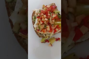 Healthy sandwich. Fried egg white with green salad on white sourdough bread.