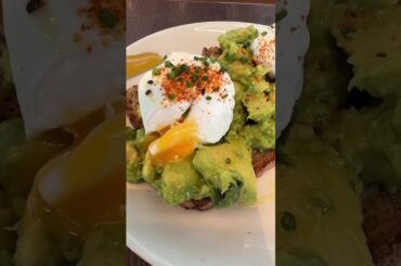 healthy avocado toast with poached eggs and togarashi chili's dust