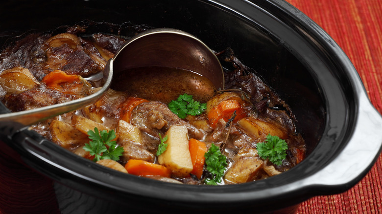 Beef stew in a slow cooker, close-up