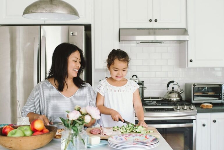 mom and daughter making lunch in kitchen - kids' school lunches