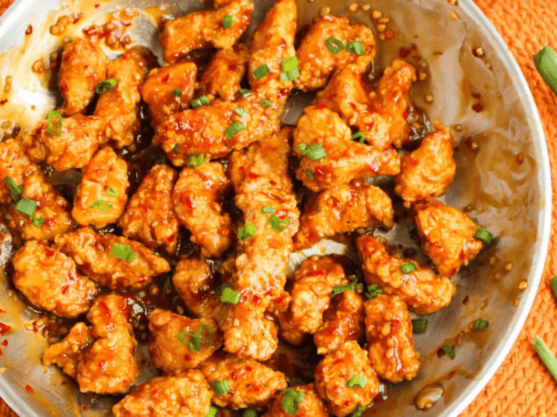 General Tso's chicken garnished with green onions.